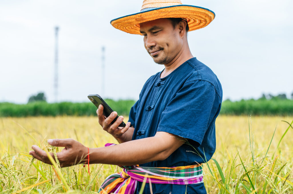 Young Asian farmer with Smart farming Agricultural technology and organic agriculture